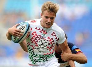GOLD COAST, AUSTRALIA - OCTOBER 12: Tom Mitchell of England takes on the defense during the Gold Coast Sevens round 1 match between England and Spain at Skilled Stadium on October 12, 2013 on the Gold Coast, Australia. (Photo by Matt Roberts/Getty Images)